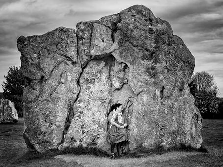 Woman Meditating the Druid Stone at Avebury