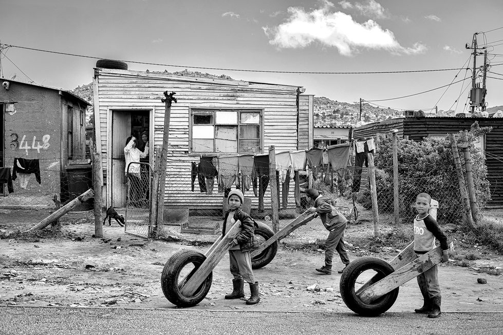 Street Racing in Naledi - from the INHERITANCE in black & white series of photographs by Mike Rossi