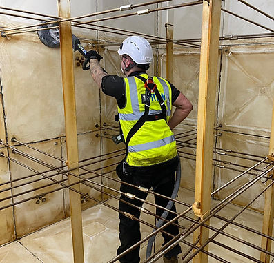 Engineer cleaning water tank