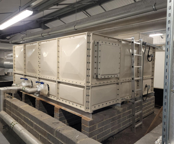 Sectional cold water tank with side access hatch.