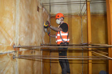 Engineer cleaning water tank