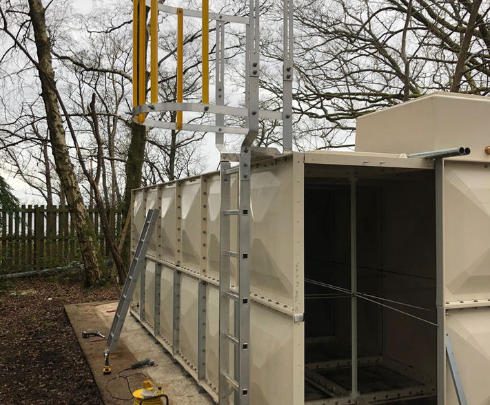 Access ladder installed on side of water tank.