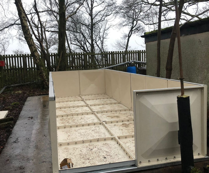 Base panels of new water tank being installed.