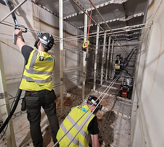 Engineers cleaning a water tank