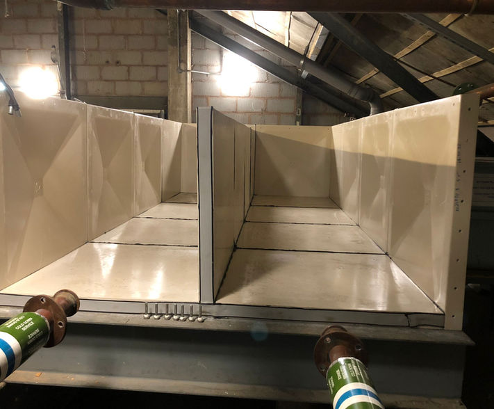 Sectional water tank being assembled.