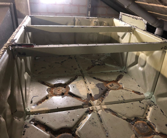 Internals of corroded water tank.