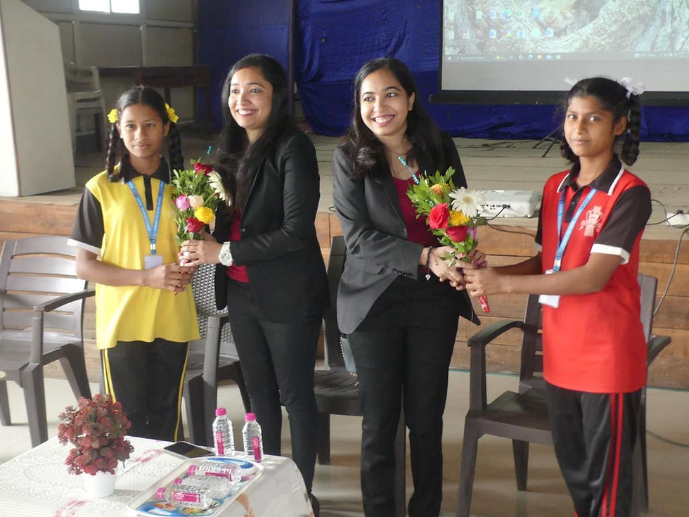 Students gifting flowers during workshop
