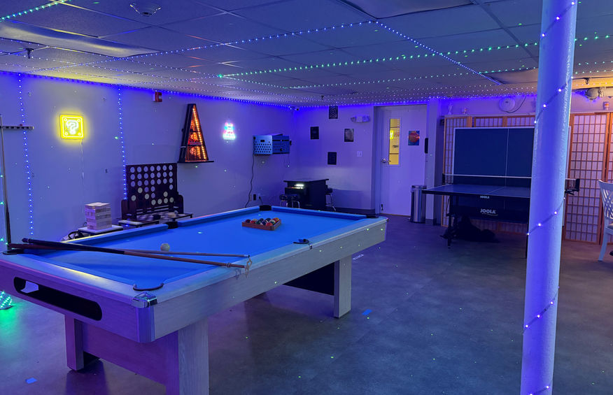 Interior view of a game room used by residents for recreation and social time.