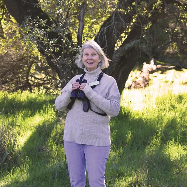 A woman with binoculars