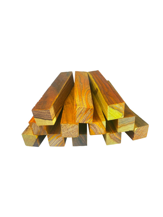 Several highly figured mahogany lumber pieces neatly stacked, ready for woodworking projects.