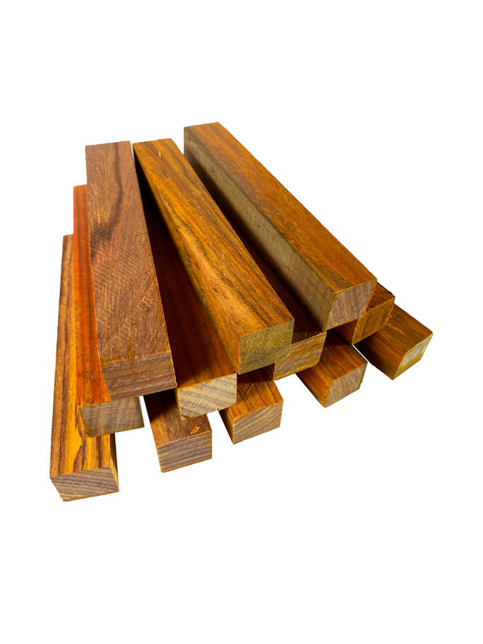 Several wood blocks, close-up view of Highly Figured Mahogany Lumber, on white background.