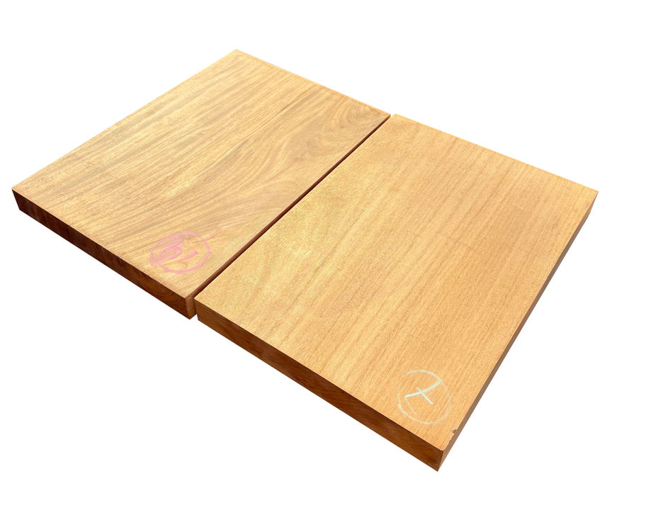 Two premium wooden boards with visible grain patterns and light color variations