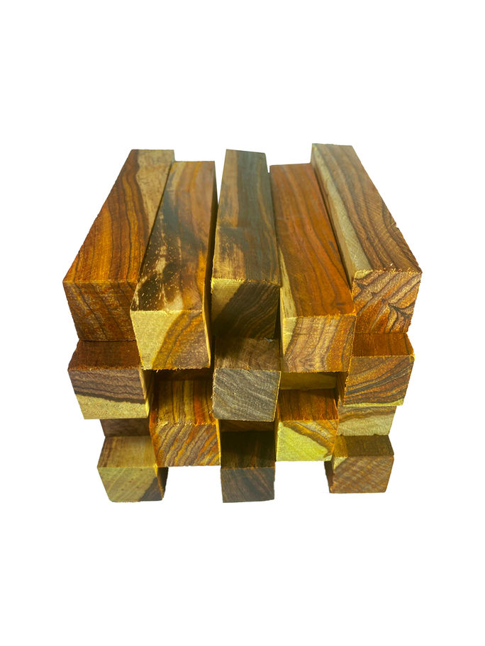 Stacked highly figured lumber blocks in a decorative pattern, ready for use.