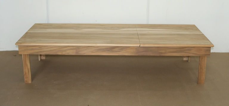 Wooden table with a crack. Diamond Tropical Hardwoods construction and simple design.