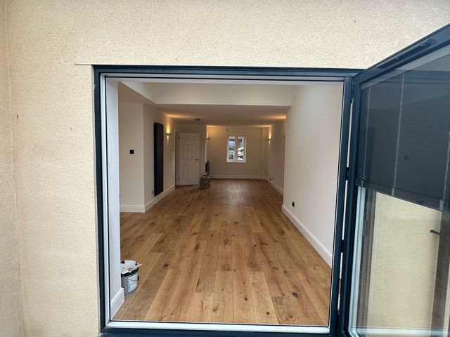 View from kitchen to lounge with full renovation of flooring and walls