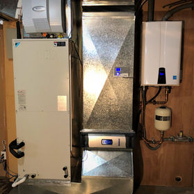 Air handler install with tankless water heater, humidifier, and AccuClean air cleaner.