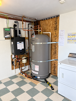 Rinnai tankless water heater, Marathon buffer tank and electrical sub-panel installed by Sunvale at an Esquimalt apartment complex
