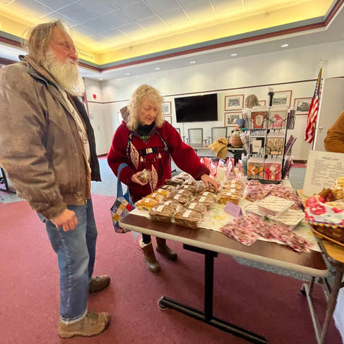 elderly couple buying food at whitewater indoor market in whitewater wisconsin