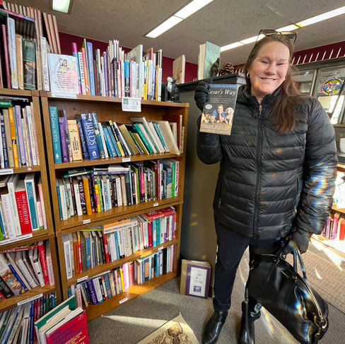 girl holding book at the book teller in whitewater wisconsin