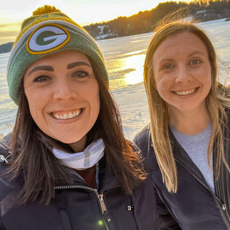 women going for a hike with sunset on rice lake in winter in whitewater wisconsin