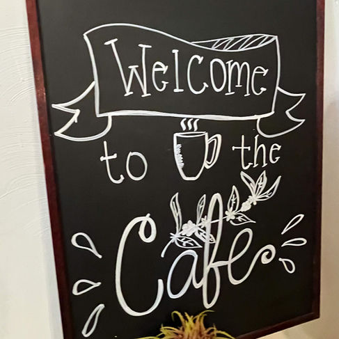 welcome to the cafe sign at sweet spot cafe in whitewater wisconsin