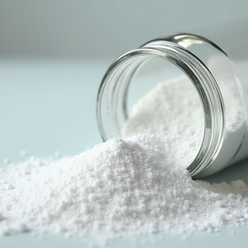 Close-up of citric acid powder in container