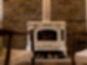 brick-fireplace-with-wood-burning-stove-two-chairs_edited.jpg