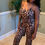 Thumbnail: Backless Leopard Jumpsuit With Head Scarf