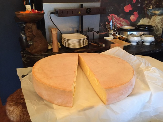 Whole Raclette cheese wheel from France. Remedy Wine Bar Vermont