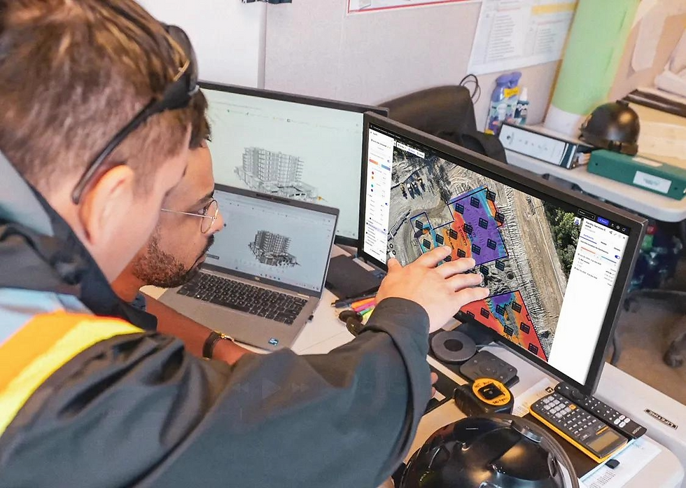 Engineer reviewing drone mapping data for a commercial project