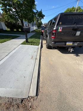 Wide paver driveway and apron replacement on a New Jersey property by Sevens Services