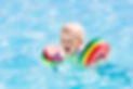Happy laughing little baby boy playing i