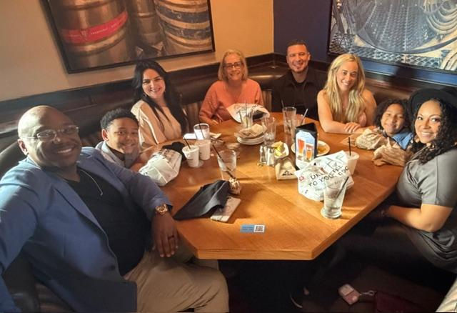Tammy & Xiomara eating lunch with members of Heartway Church