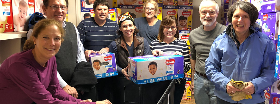 volunteers back donated diapers for distribution