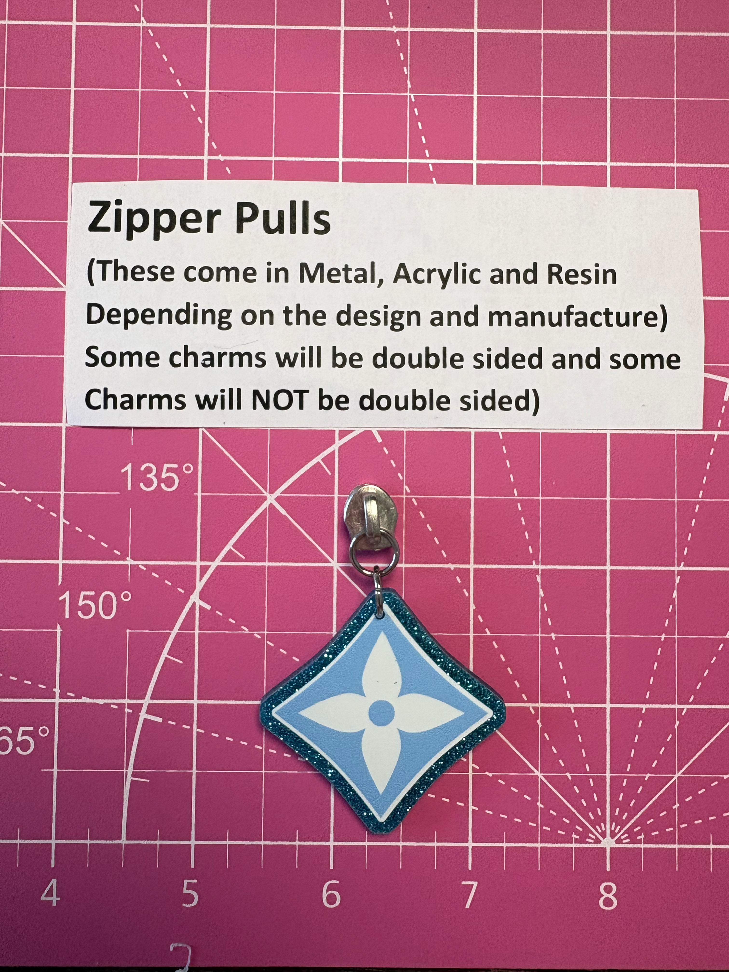 Zipper Pull- lv symbol light blue