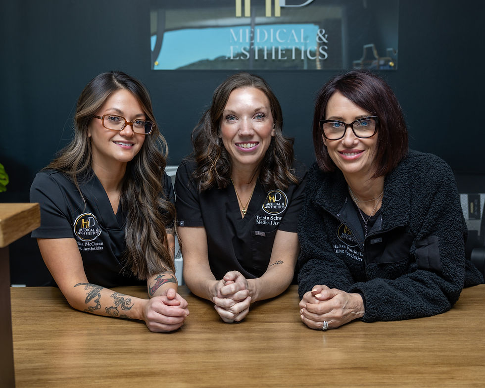 Team members sitting at the front desk
