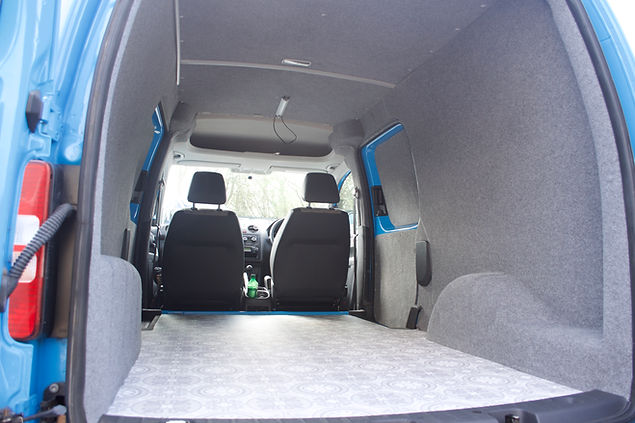 Blue Caddy conversion into a base camper at Apple County Customs