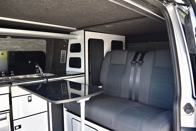 SWB T6 campervan conversion with Hilo roof, gloss white units, refillable Gaslow gas system, Vanshades, Evo Motion Design