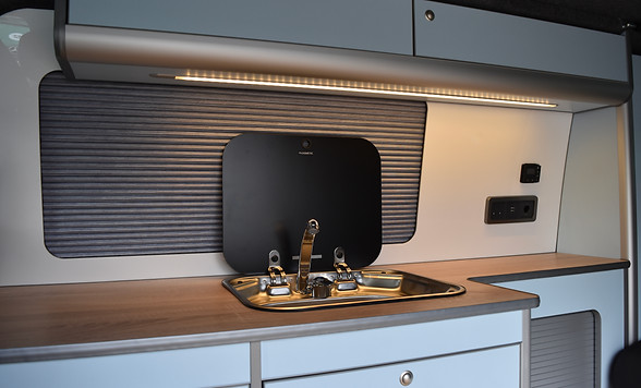 VW camper conversion kitchen interior with a Dometic 8005 singular sink by Apple County Customs in Bristol