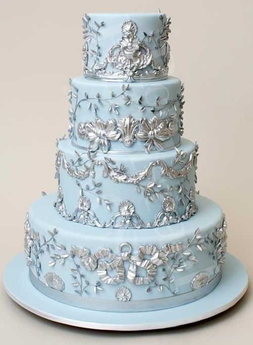 Beautiful light blue cake with silver filigree and accents