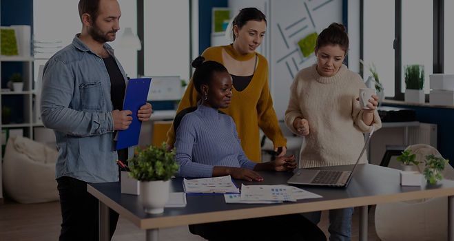 diverse-group-of-colleagues-looking-at-laptop-webcam-during-video-conference-meeting-in-st