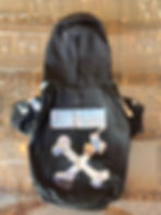 Thumbnail: Woof crossbone fleece lined hoodie with hole for lead attachement