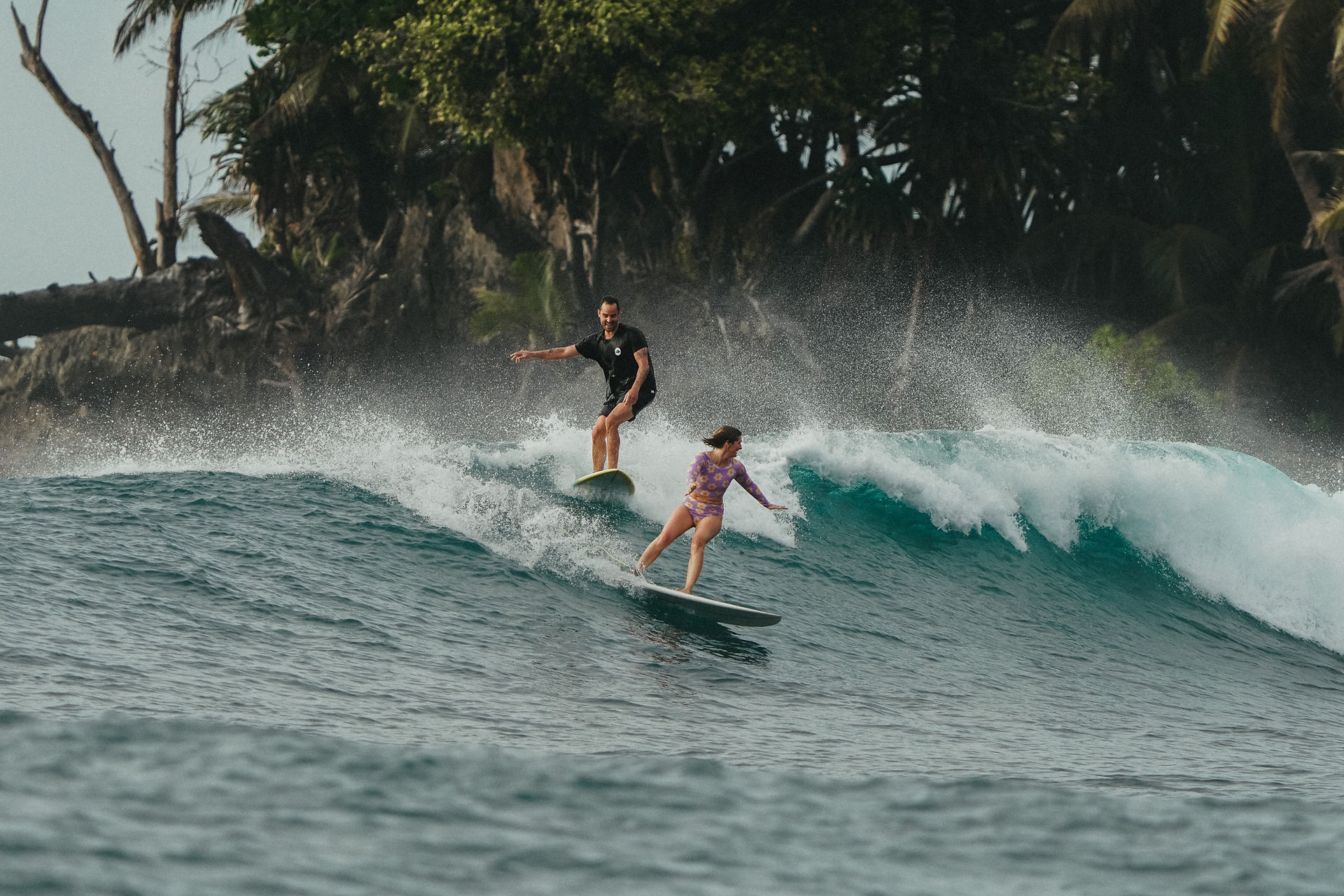 Surf couple party wave
