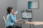 Woman working with monitor and headset on