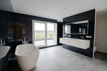 Luxury bathroom with freestanding bathtub and panoramic window, real estate photography Luxembourg