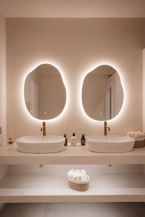 Luxury bathroom with double sink and round illuminated mirrors, spa interior photography Luxembourg