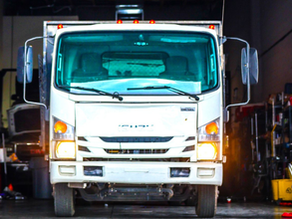 Commercial fleet box truck inside Cruz Auto & Fleet Services repair shop in Las Vegas for maintenance and fleet repair service.
