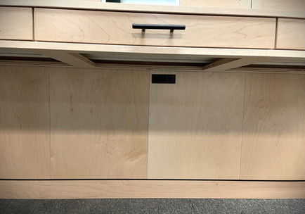 An outlet added under the Murphy bed desk with regular plugs, USB-A and USB-C ports. 