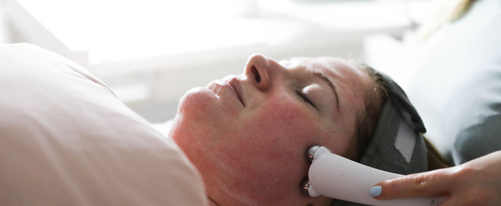 Relaxing facial treatment at JEMS Health & Beauty, with a therapist performing a bespoke facial tailored to the client's skin needs.