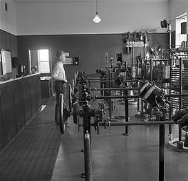 Engineer_Eero_Frantsila_beside_Telefunken_transmission_equipment_in_Lahti_radio_station,_1